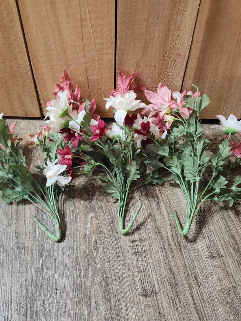 vintage floral arrangement of artificial flowers in small vase